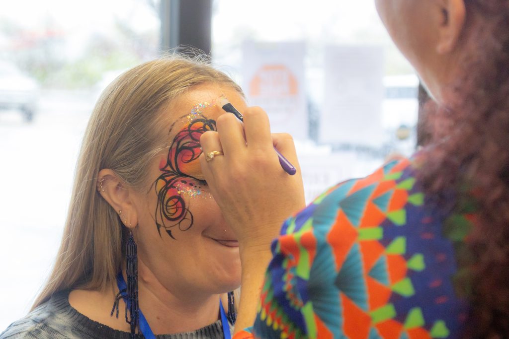 girl getting her face painted