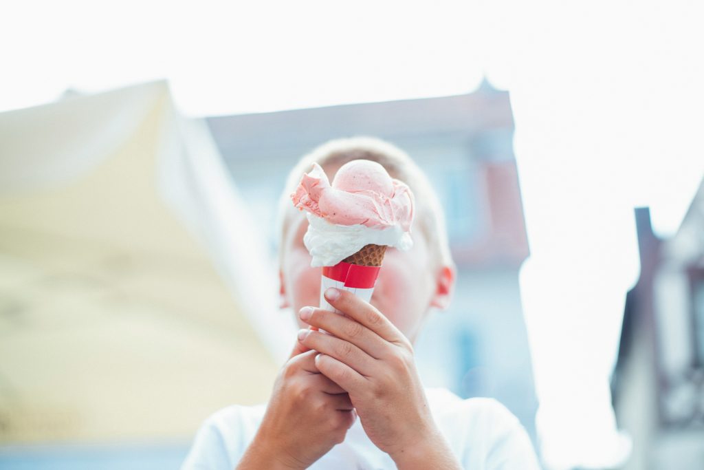 young boy holding ice cream
